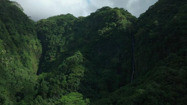 Faarumai Waterfall Falls Valley Tahiti French Polynesia aerial drone Vaimahuta Fall Tiarei Hitiaa O Te Ra watershed picturesque river cascades trees forest jungle daytime sunny blue sky forward reveal