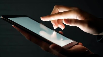 Close-up of hands holding digital tablet with blank screen