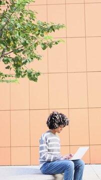 Mixed race girl enjoying a peaceful day on university campus