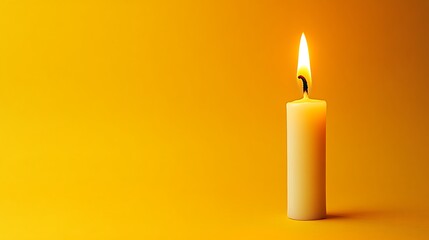 burning candle on black background