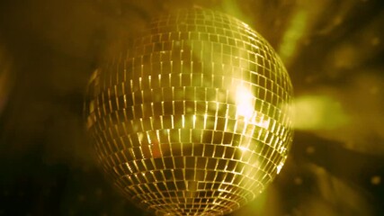 Shimmering disco ball reflects vibrant lights during lively dance party at a local club on a Friday night