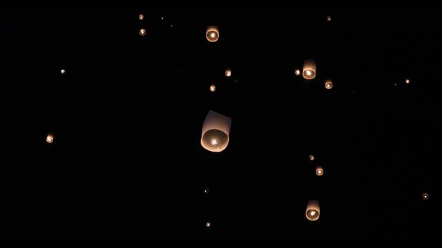 Asian fire lanterns launching during festival yee peng festival. Loy Krathong celebration, Chiang Mai, Thailand