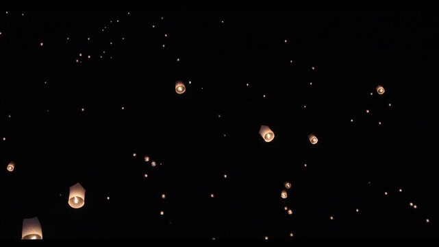 Asian fire lanterns launching during festival yee peng festival. Loy Krathong celebration, Chiang Mai, Thailand