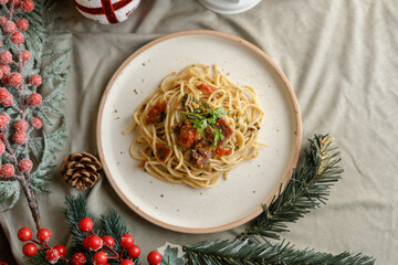 Festive pasta dish surrounded by Christmas decorations, capturing holiday vibes with lights, ornaments, and a cozy festive setting. Perfect for themes like Christmas food, holiday celebrations.