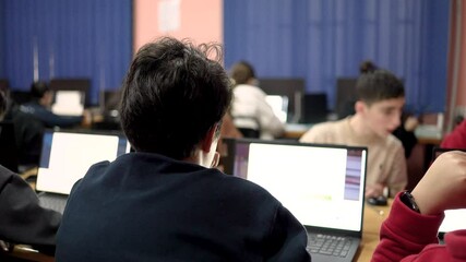 Students work on the computer during a computer science lesson