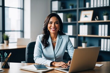 Fototapeta premium Radiant Young Latina CEO Smiling at Camera in Office Workspace with Laptop