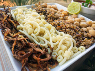 Koshary, kushari or koshari (Egyptian Arabic: كشرى Egypt's Traditional national dish