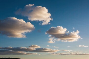 Obraz premium Vibrant White Clouds in a Peaceful Blue Sky