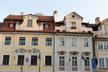 Obraz premium The colorful facades of the historic buildings in a charming European city beautifully showcase a diverse range of architectural styles and intricate urban design elements found throughout