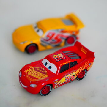 Selective focus shot of the Mattel Lightning McQueen toy model race car from the Disney Pixar Cars