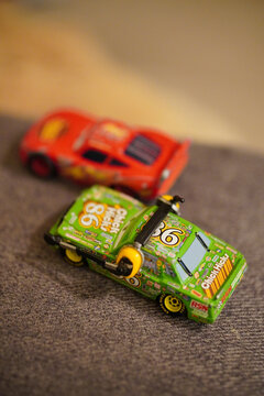 Vertical shot of Mattel Disney Pixar Chick Hicks and Lightning McQueen toy model race cars