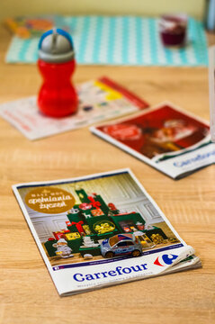 Fiat 500 toy car on a Carrefour brochure with a Christmas theme
