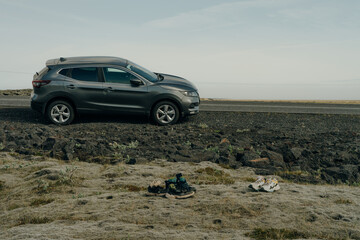 Fototapeta premium Volcanic landscape of the valley in South Iceland with an off-road 4x4 car