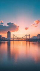 Obraz premium Stunning sunset over the Christiana River with a beautiful reflection of the bridge and city skyline in the background