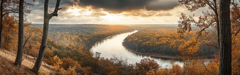 A breathtaking view of the Hoosier National Forest at sunset, highlighting vibrant autumn foliage and the winding river below