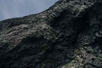 Reynisfjara black sand beach in Iceland, near town of Vik, at sunrise, beautiful basalt rock...