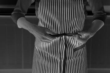 Woman tying apron strings