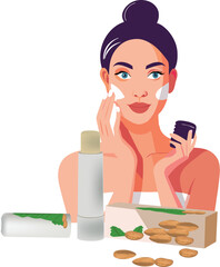 Woman applying organic almond cream on face