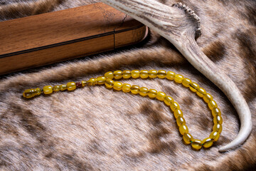 Macro detail shot of Ottoman amber rosary. Conacept rosary beads (Amber and Bakelite material)