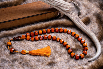Macro detail shot of Ottoman amber rosary. Conacept rosary beads (Amber and Bakelite material)