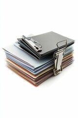 Stacked papers, clipboard, metal clamp, organized documents.