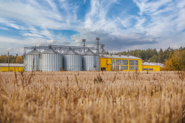 agro-processing and manufacturing plant for processing and silver silos for drying cleaning and storage of agricultural products, flour, cereals and grain. Granary elevator © hiv360