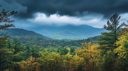 Obraz premium A distant mountain range under darkening clouds, with rain beginning to fall in the background