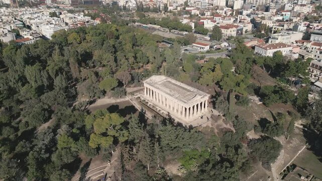 Ancient temple of Hephaestus in historical centre of Athens, Agora aerial panoramic footage