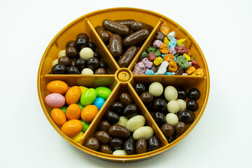 Dragee candies mixed. chocolate covered almonds, peanuts, hazelnuts and colorful candies