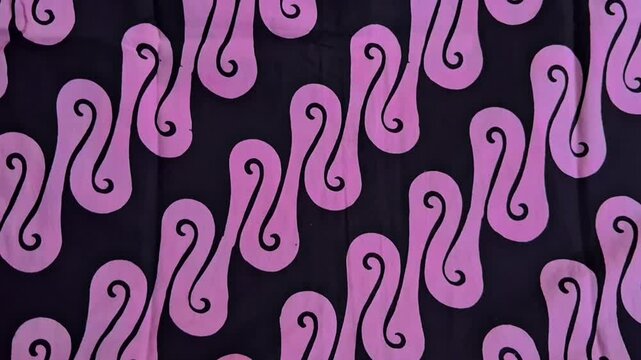 Batik,a simple pattern of batik cloth,printing type of batic with black and pink element color.Indonesian traditional art that have been recognized by UNESCO.Indonesian cultural heritage,Batik Parang