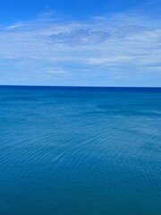 Fototapeta premium Blue ocean and cloudy sky