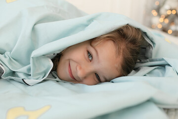child sleeping in bed