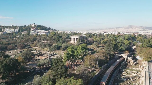 Ancient temple of Hephaestus in historical centre of Athens, Agora aerial panoramic footage