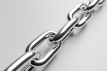 Obraz premium A close-up view of a shiny metal chain, highlighting its interlinked links and smooth surface against a neutral background.