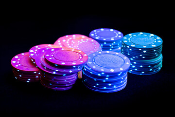 Poker chips and neon casino playing cards