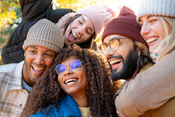 Cheerful group of friends taking smiling selfie. Happy people having fun together outdoors on vacation holidays. Concept of community, youth lifestyle and friendship. High quality photo