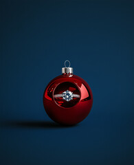 An advertising concept for Christmas jewelry featuring a red gemstone ring inside a dark blue and silver ornament with stars, showcasing the beauty of the gemstone in a simple yet elegant design.