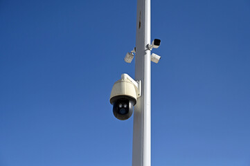 CCTV cameras on metal pole.  Professional Security cameras scanning the street. Recording video with cams. Surveillance of streets and square in the city. 