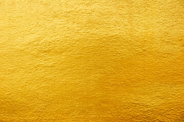 Golden texture cement wall background.