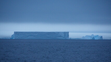 Large, flat iceberg floating in the Southern Ocean near Kinnes Cove, Joinville Island, Antarctica