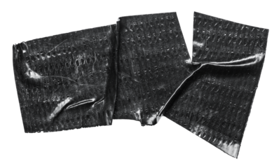 Isolated cut out wrinkled torn adhesive black tape sticker piece or label with texture copy space on transparent png background design element