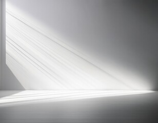 Obraz premium Minimalist architectural space with dramatic diagonal window light casting parallel shadow lines on a white floor and gray wall