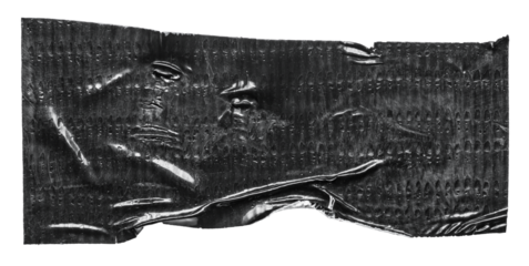 Isolated cut out wrinkled torn adhesive black tape sticker piece or label with texture copy space on transparent png background design element