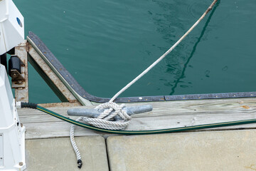Tied rope and calm turquoise waters, showcasing a serene marina environment in Key West.