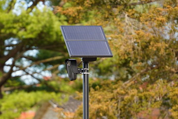 Flock safety police law enforcement license plate reader set up outside to help catch vehicle speeders.