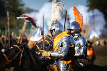 Prince of Orange in armor, costumes playing siege. Historical event. Action scene. knight leads the battlefield riding on his horse