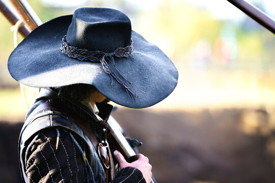 Large black felt hat with medieval dressed soldier from the time of the Dutch battle during the 80 Years War of the Dutch Republic