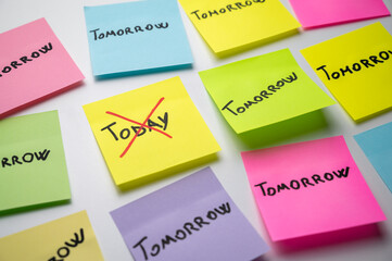 Colored card, with the word Today, crossed out, and next to it cards with the word Tomorrow....