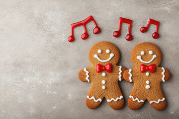 Fototapeta premium Cheerful gingerbread cookies with musical notes, perfect for holiday celebrations and festive baking.