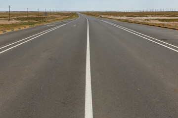 Fototapeta premium Asphalt road in Kazakhstan. Mangystau Region